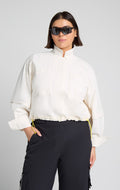 Woman wearing SENIQ Dirtpop Trek Jacket and Trailmix Pants
