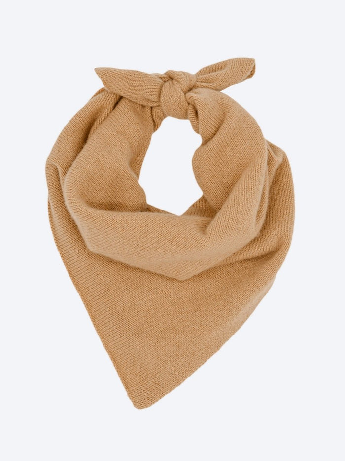 Camel cashmere neck square knotted into a triangular scarf shape.