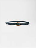 Close-up of a slim navy suede belt with an oval gold buckle