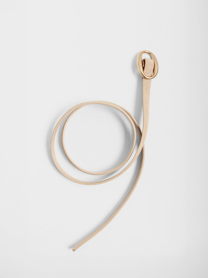 Tan suede belt with a gold buckle, coiled on a plain background