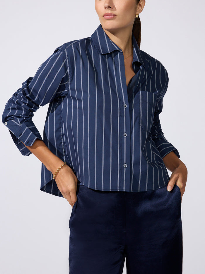 Everyday cropped shirt in Hartford stripe, model wearing navy blue pinstripe button-up shirt with matching navy pants
