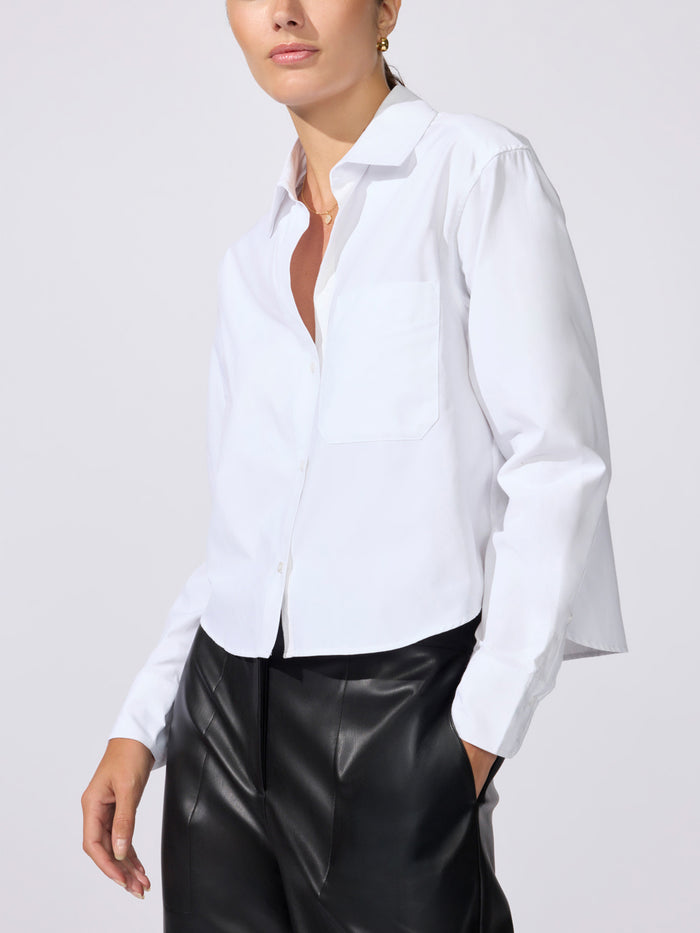 Everyday cropped shirt in salt white, model wearing long-sleeve button-up shirt with black leather-look pants