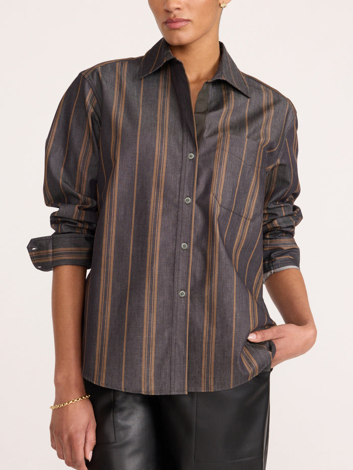 Woman wearing the Brochu Walker Everyday Shirt in Sedona Stripe, a striped cotton button-down shirt paired with black leather pants.