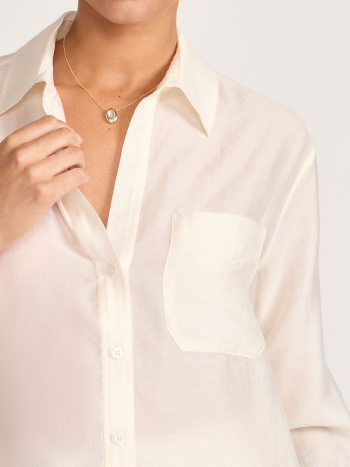 Close-up of a cream voile button-down shirt with a chest pocket
