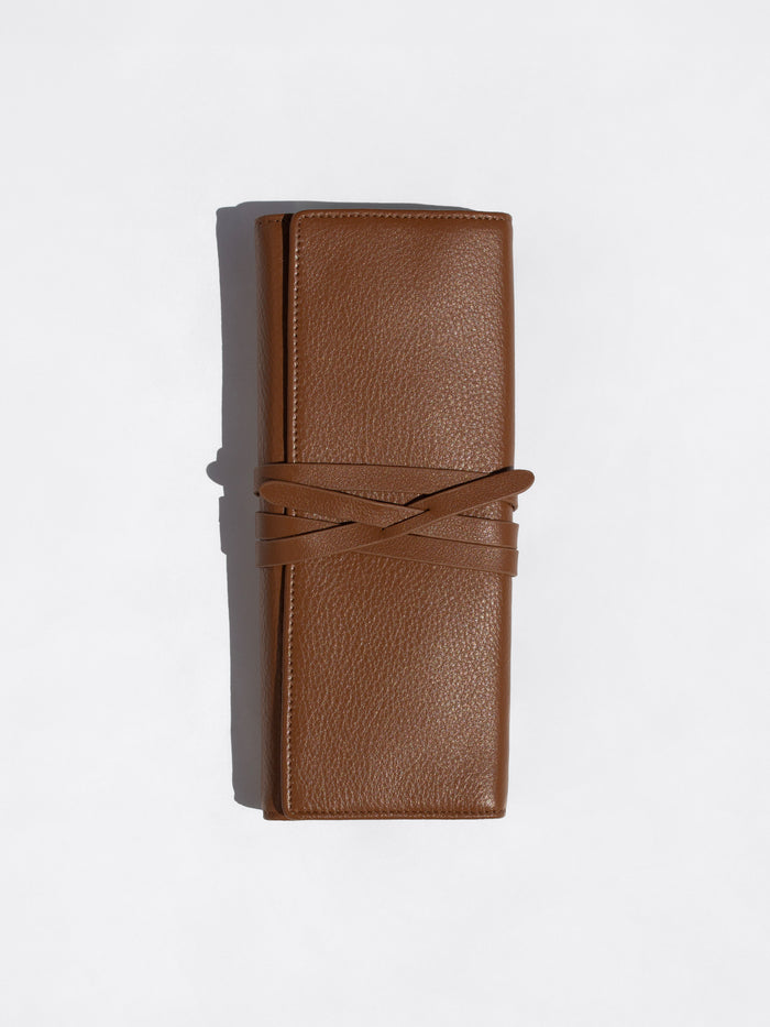 Cognac brown Brochu Walker Leatherology wallet standing upright with its wraparound tie closure