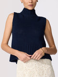 navy chunky knit sleeveless turtleneck vest styled with ivory crochet skirt and gold jewelry