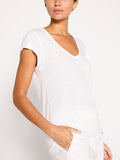 Koda tee in salt white, a short-sleeve V-neck top styled with matching white bottoms.