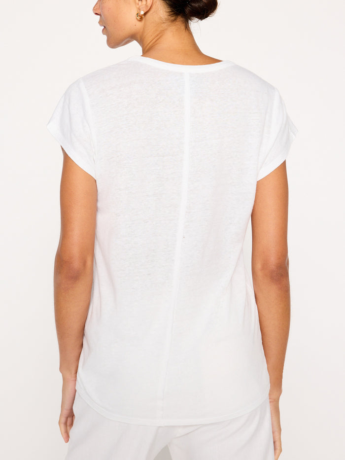 Koda tee in salt white, back view of the loose short-sleeve top paired with white bottoms.