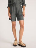 Maris voile short in brownstone, a cropped front view of the pleated shorts paired with platform sandals.