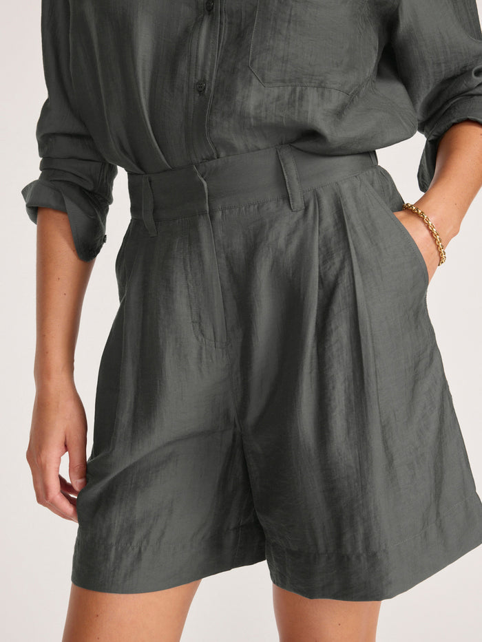 Maris voile short in brownstone, a close-up of the pleated shorts styled with a matching button-up shirt.