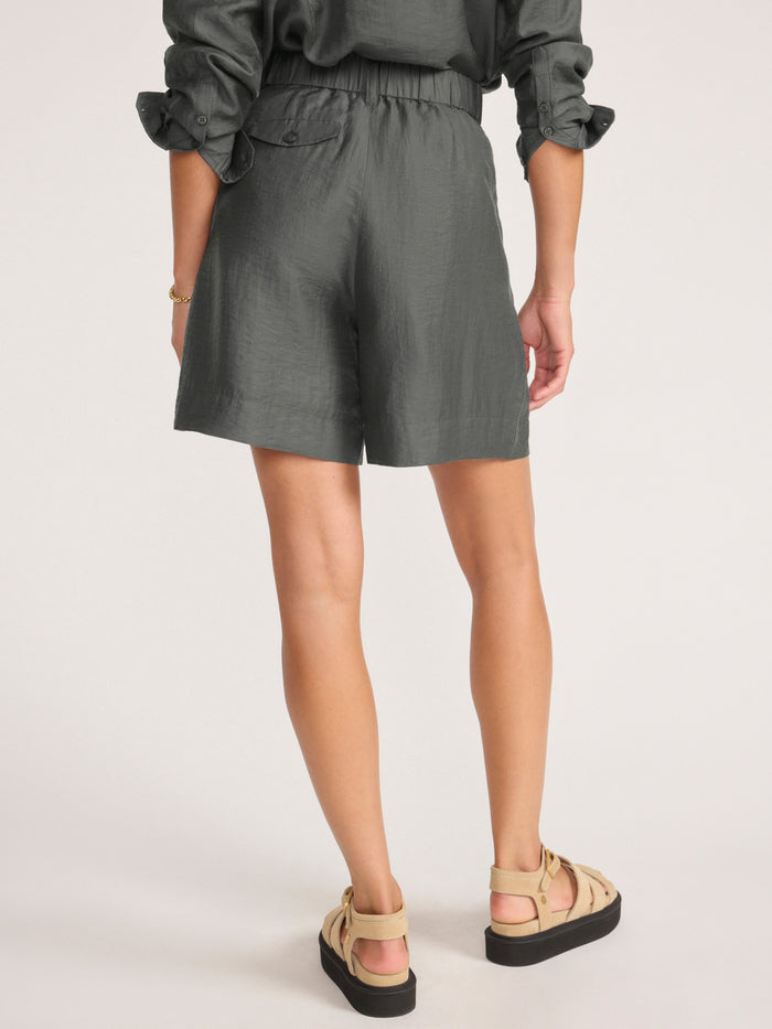 Maris voile short in brownstone, a back view of the pull-on shorts paired with platform sandals.