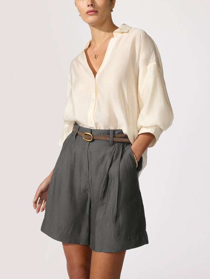 Kate voile shirt in creme, a long-sleeve blouse styled with Maris voile shorts in brownstone and a leather belt.