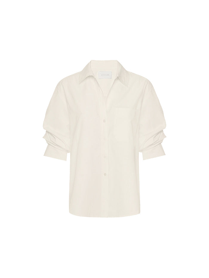 Pia Calico shirt in cream, a flat lay of the button-up shirt with a chest pocket and ruched sleeves.