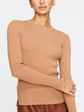 Women's ribbed sweater in camel with long sleeves and a fitted silhouette paired with a brown leather skirt.