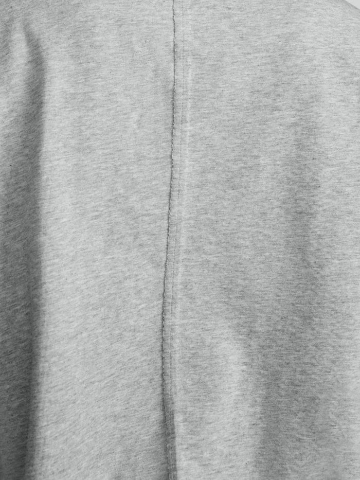 Close-up of pebble grey heathered knit fabric with a center back seam and zipper detail